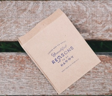 Multi-color and natural kraft paper bags in a range of sizes.